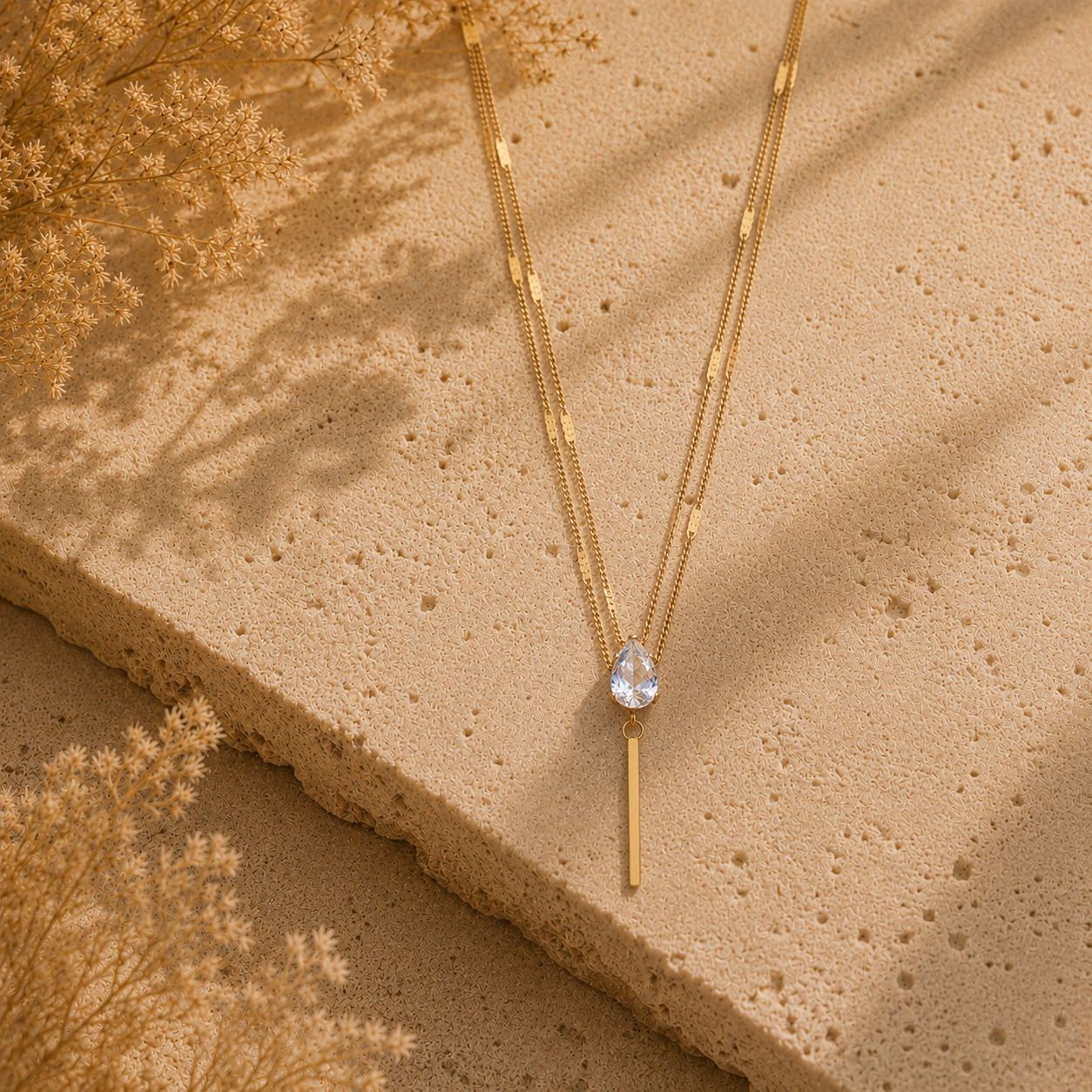 Collier Éclat – Double chaîne dorée & pierre goutte