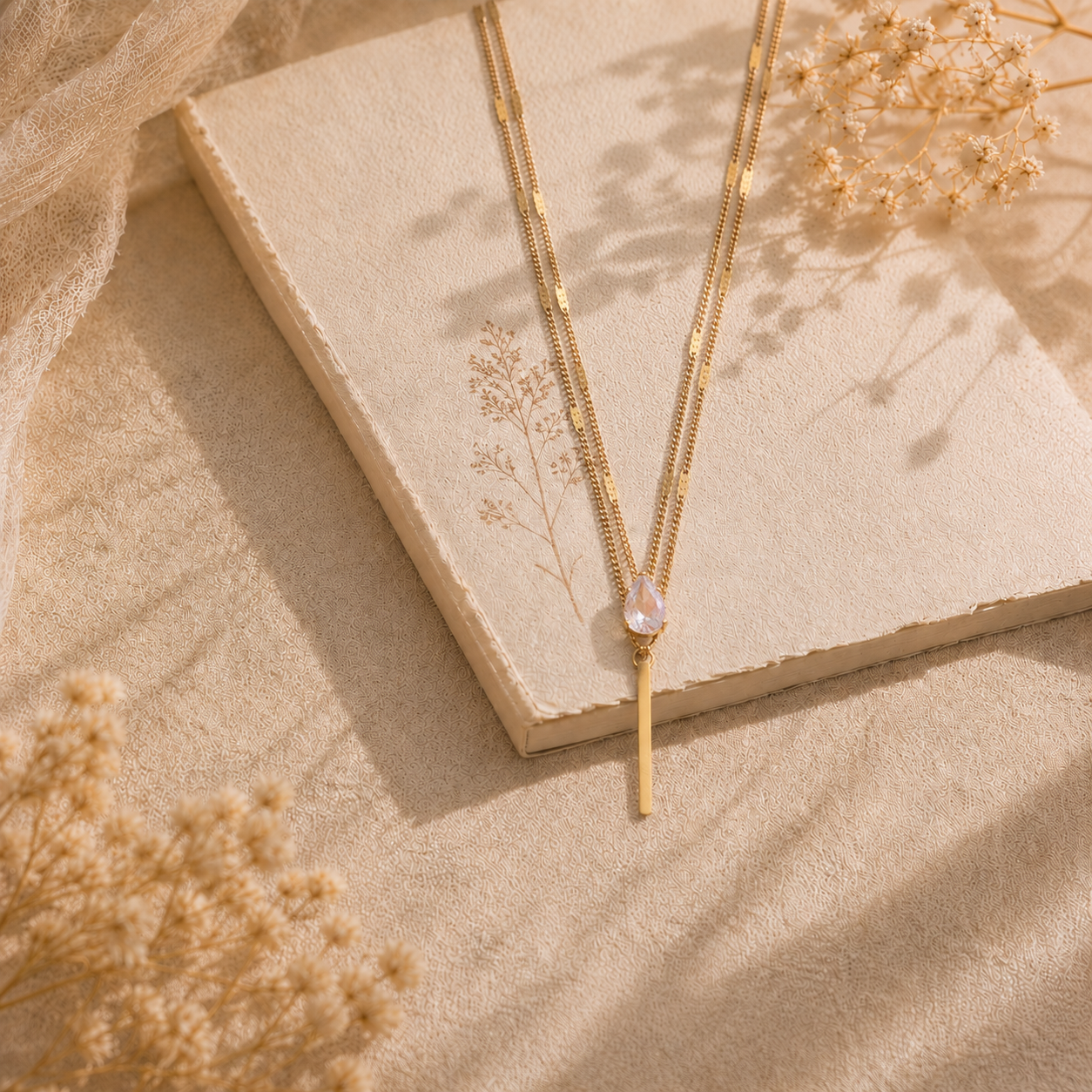 Collier Éclat – Double chaîne dorée & pierre goutte